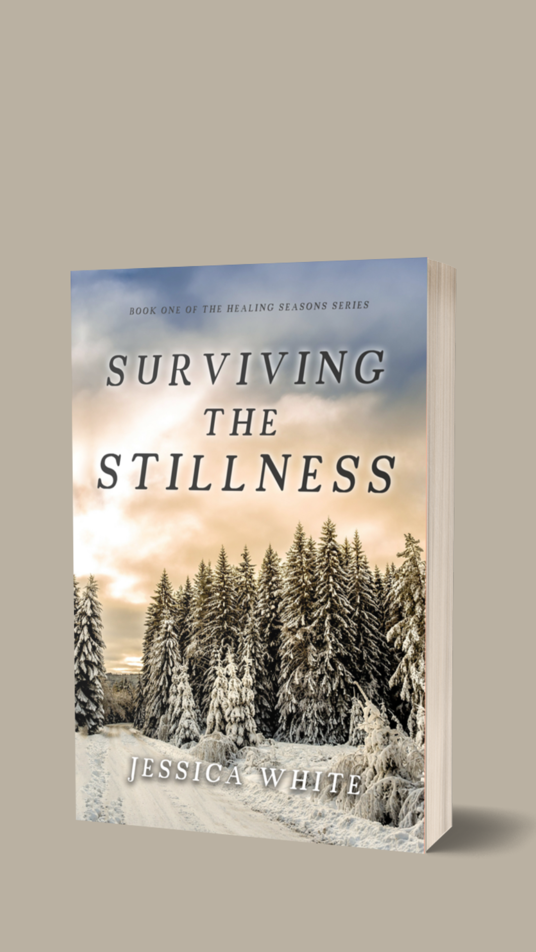 Surviving the Stillness. A snowy path between tall snow dusted pines with a pink and blue clouded sky.